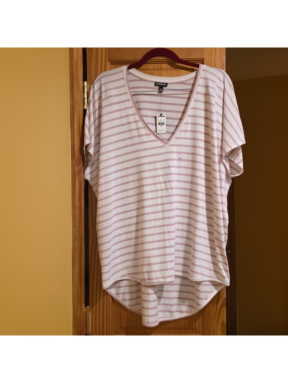 Express brand, size XL, light pink and white horizontal stripes with a...